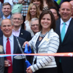 Luanne Cundiff cuts the ribbon in honor of First State Bank's 150 year celebration