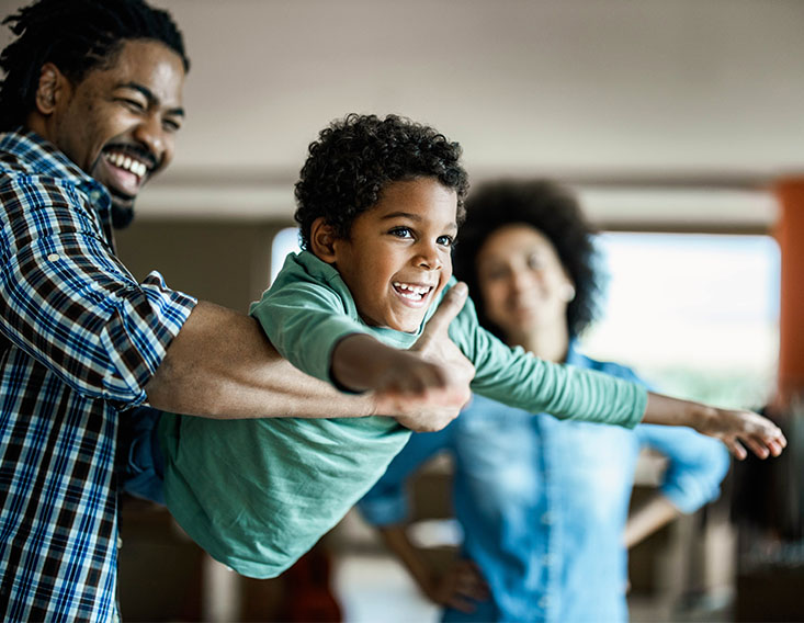 Father holding son in arms getting ready to swing him