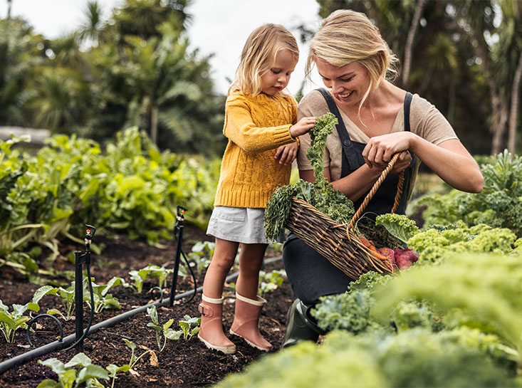 Mother gardening with her daughter