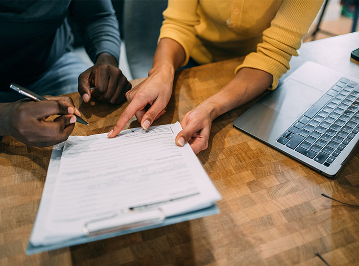 Couple applying for a loan at Frist State Bank