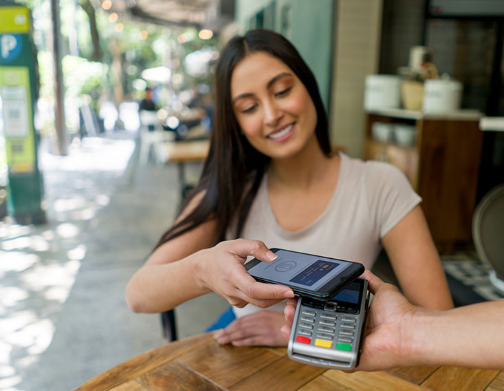 First State Bank customer using her digital wallet