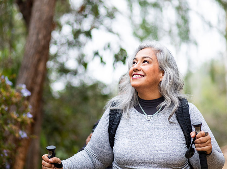 Woman hiking and thinking about First State Bank's special offers