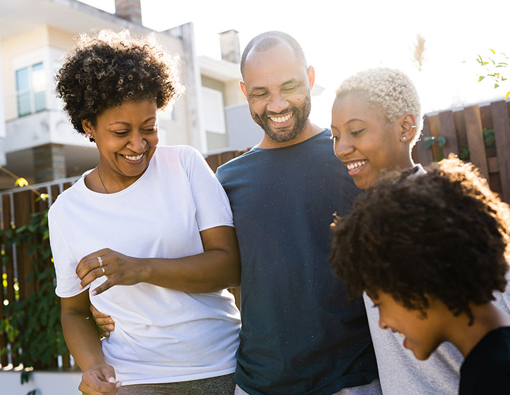 Family outside enjoying while their savings grows in a money market account