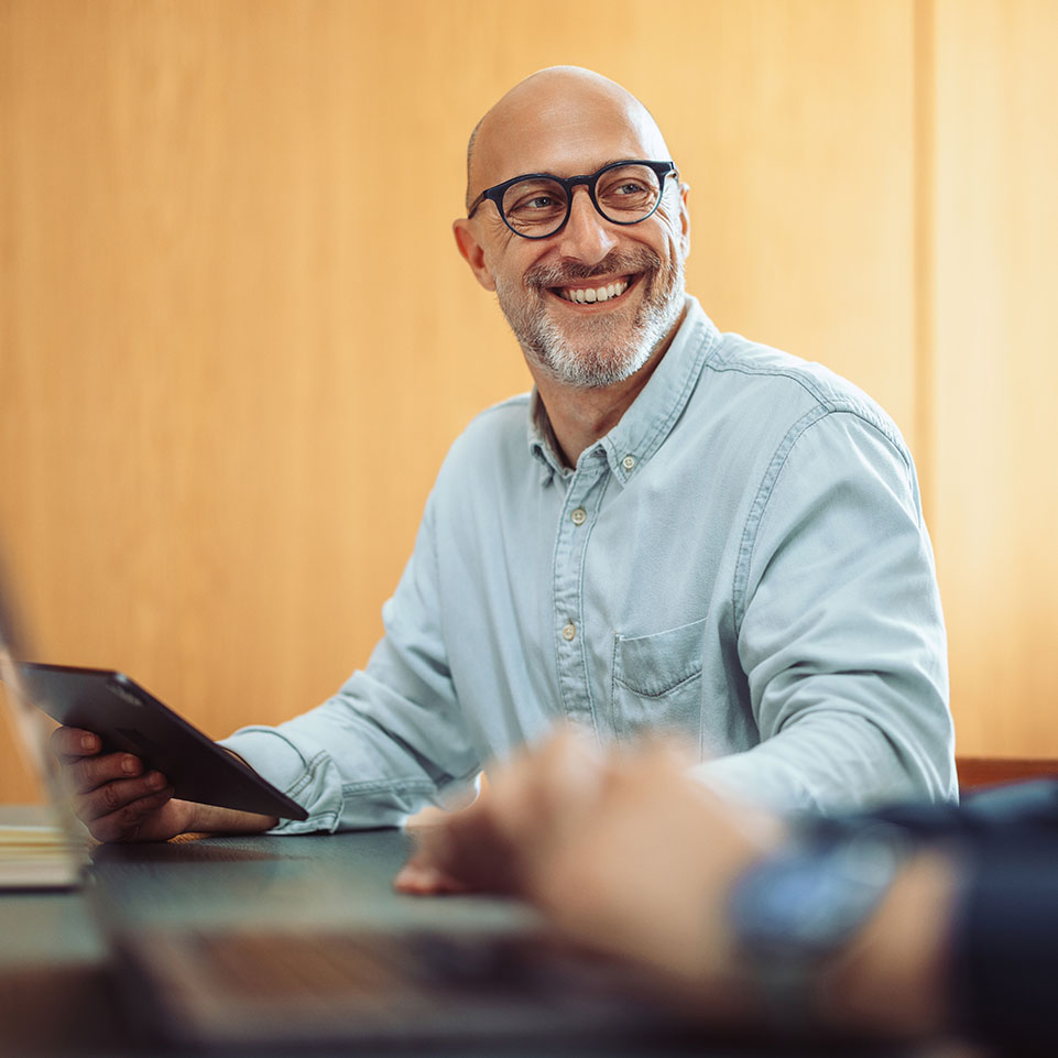 Business owner enjoying his First State Bank business checking account with cash management solutions