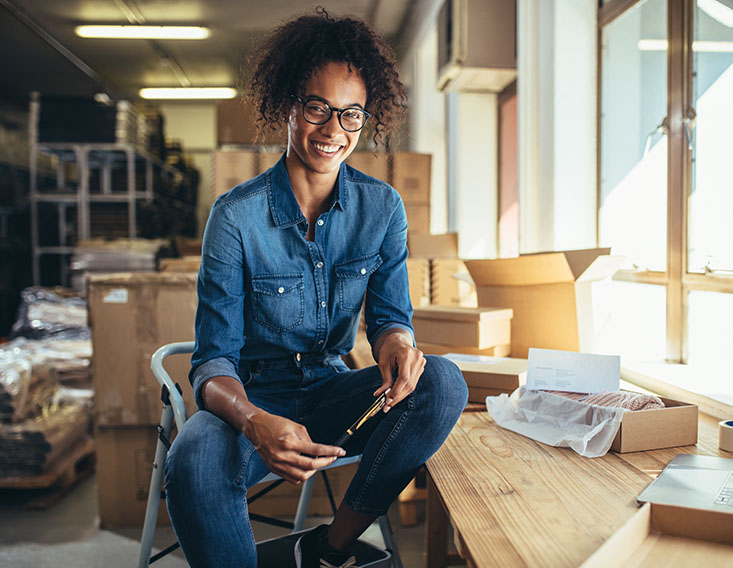 Business woman enjoying her Business Checking account from First State Bank