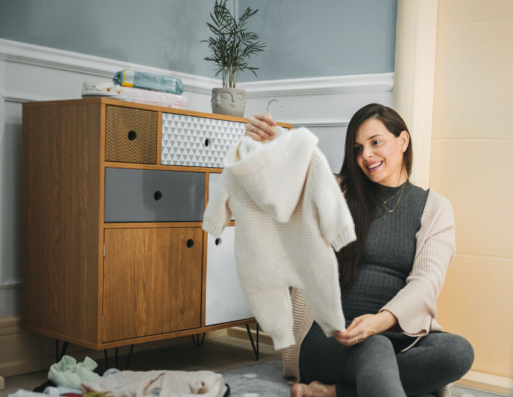 Mother planning for her baby's expenses with a HELOC loan from First State Bank Mortgage