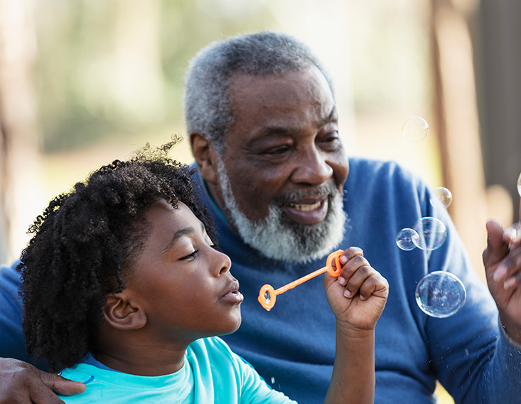 Grandfather enjoying time with his grandson after purchasing a gift card from First State Bank