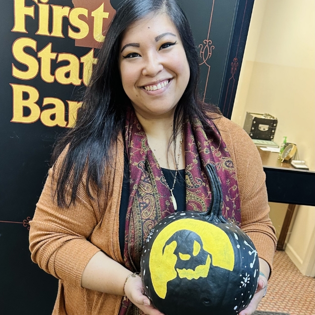 Jess Guillaume showing her pumpkin during the annual pumpkin decorating content