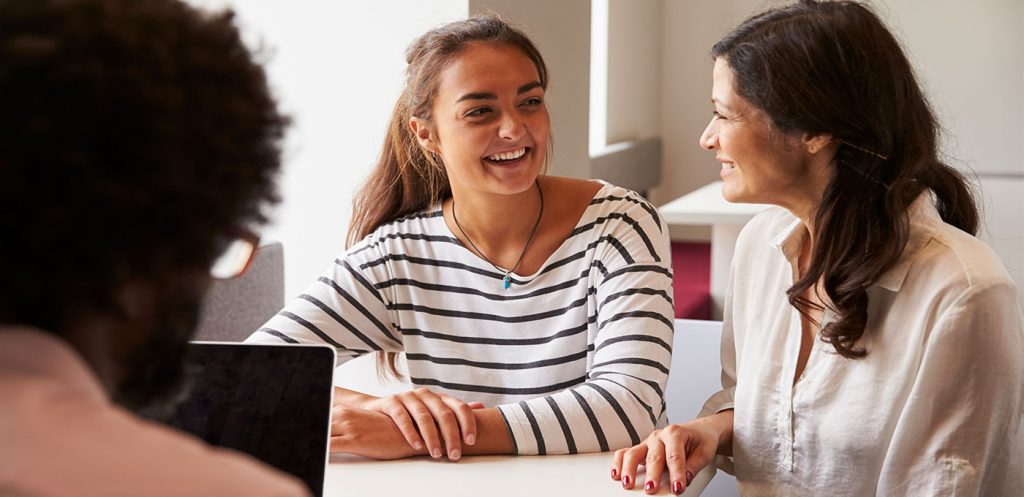 College student and mother prepare financially for college by reviewing the college financial checklist at First State Bank.
