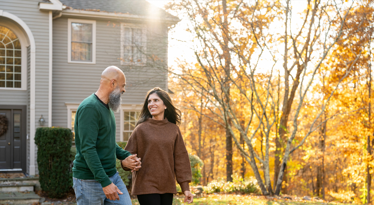 Couple enjoying a new home in the fall.