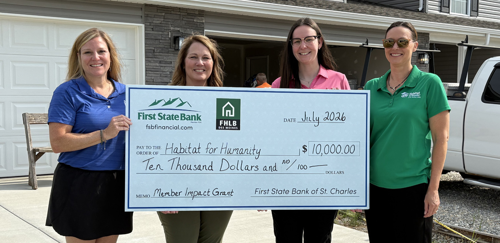 Habitat for Humanity of St. Charles County receiving funding from First State Bank through the FHLB grant.
