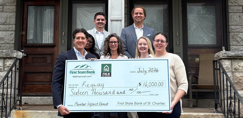 Keyway receiving receiving a check from First State Bank through the FHLB grant.