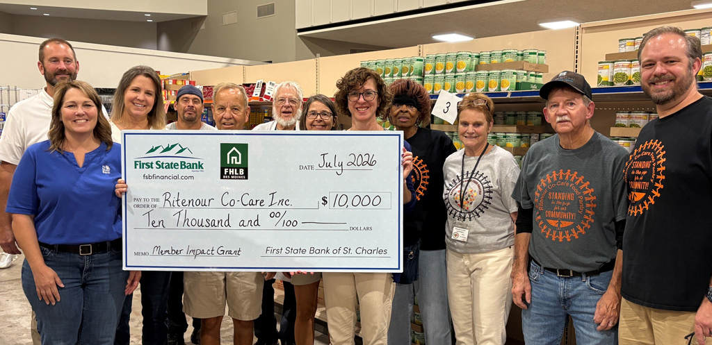 Ritenour Co-Care, Inc. receives a check from First State Bank to help them purchase groceries for their client-choice food pantry.