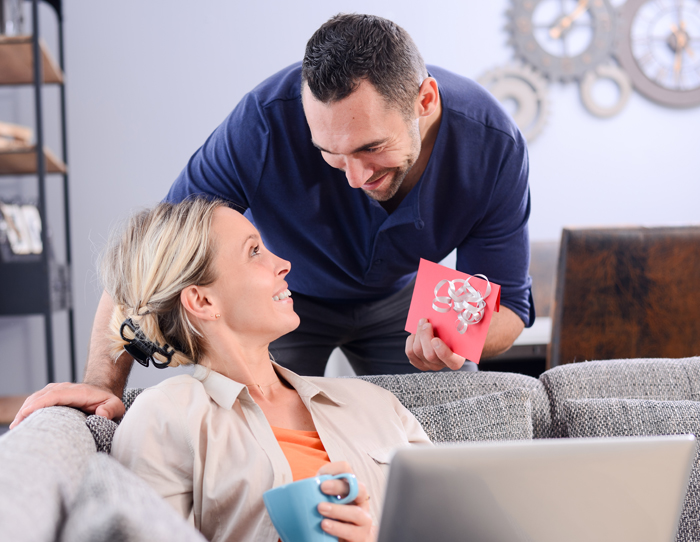Husband giving his wife a First State Bank Gift Card.
